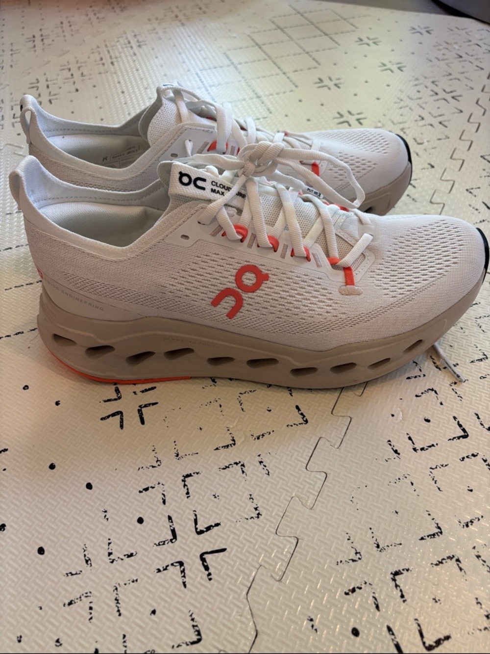 On Running Cloudsurfer Max White Athletic Sneakers with Coral Accents